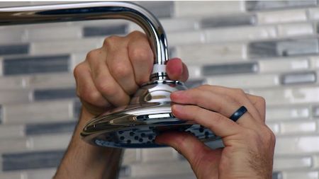Unclog your shower head holes
